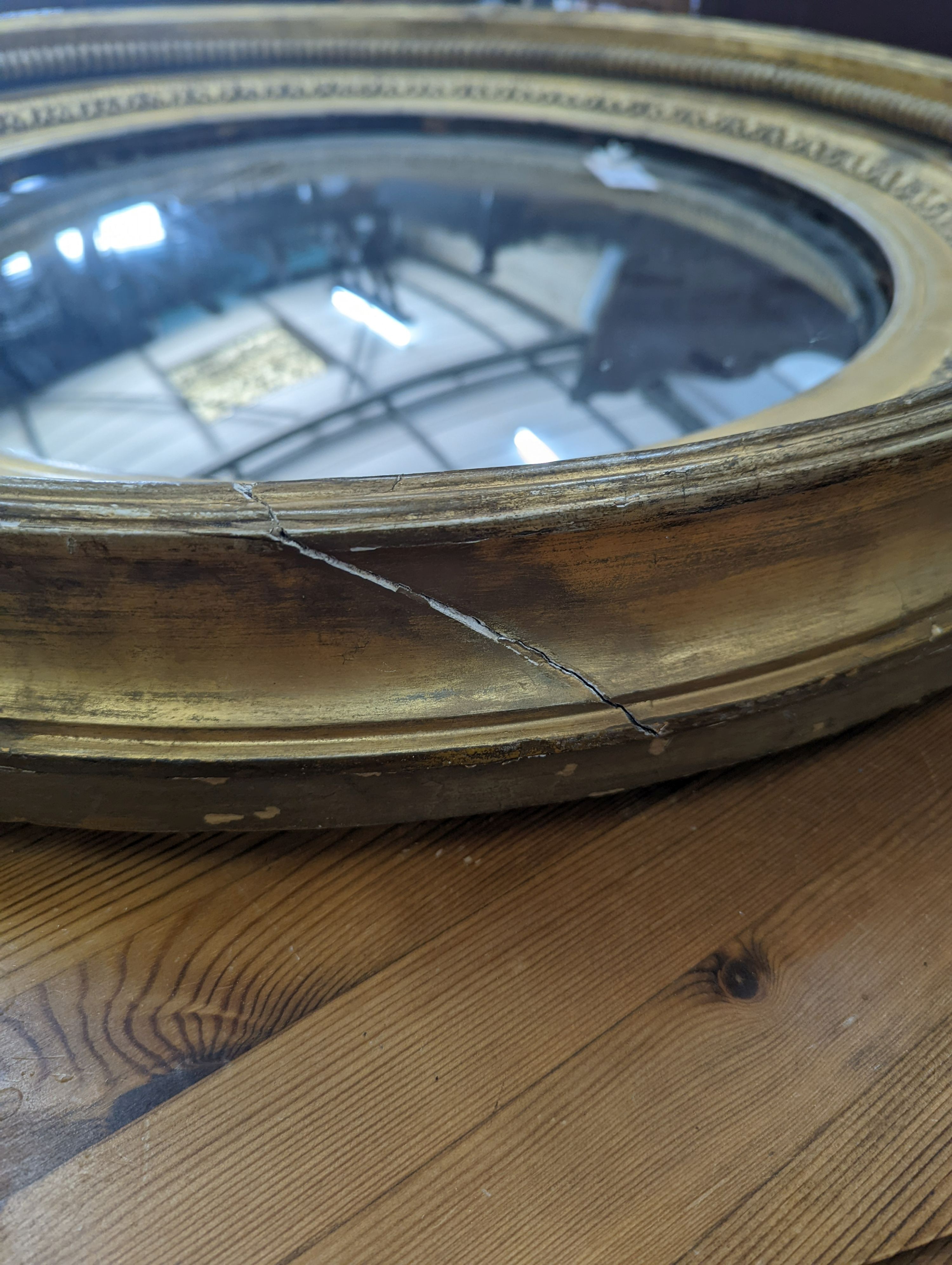 A large Regency circular giltwood and gesso convex wall mirror, diameter 86cm